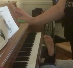 student foot on piano